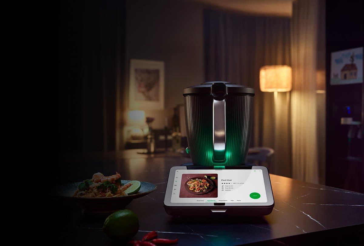 Vorwerk Thermomix TM7 with integrated touchscreen showing Cookidoo AI recipe guidance