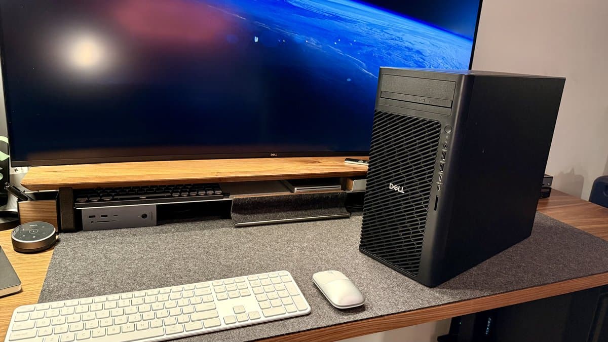 Dell U2723QE UltraSharp monitor in a professional workspace setting