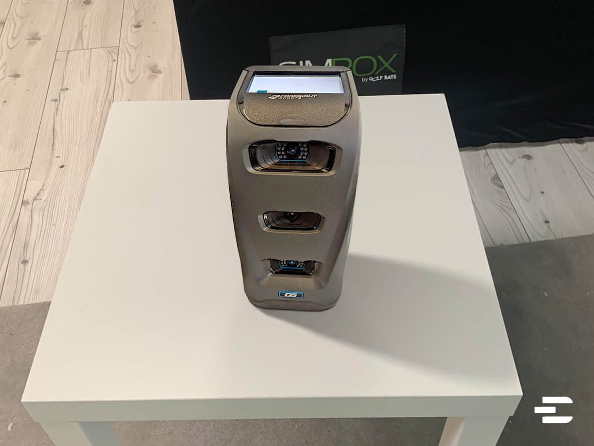 Bushnell Launch Pro launch monitor with professional setup showing detailed swing analysis on connected tablet