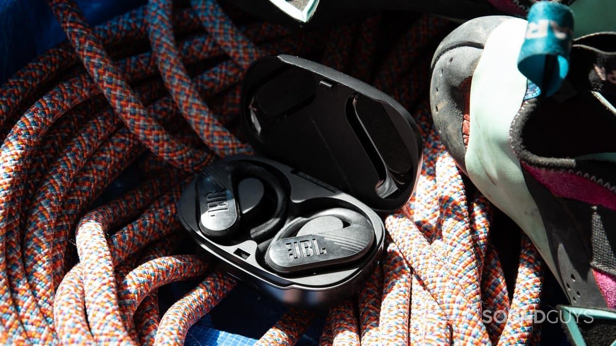 JBL Endurance Peak 4 true wireless open-ear earbuds with silicone ear tips and charging case
