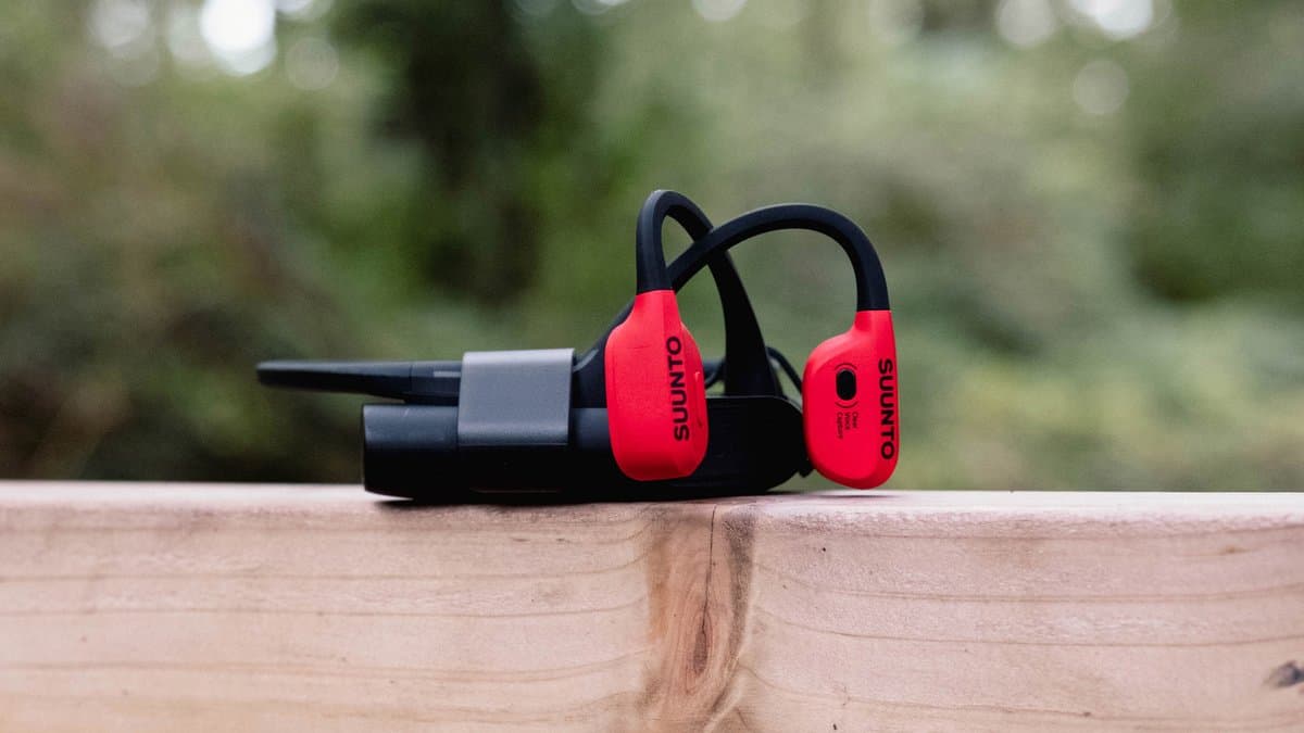 Suunto Wing bone conduction headphones on young runner showing lightweight titanium construction