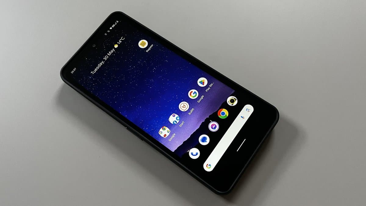 CAT S75 rugged smartphone being used on a construction site with workers in hard hats