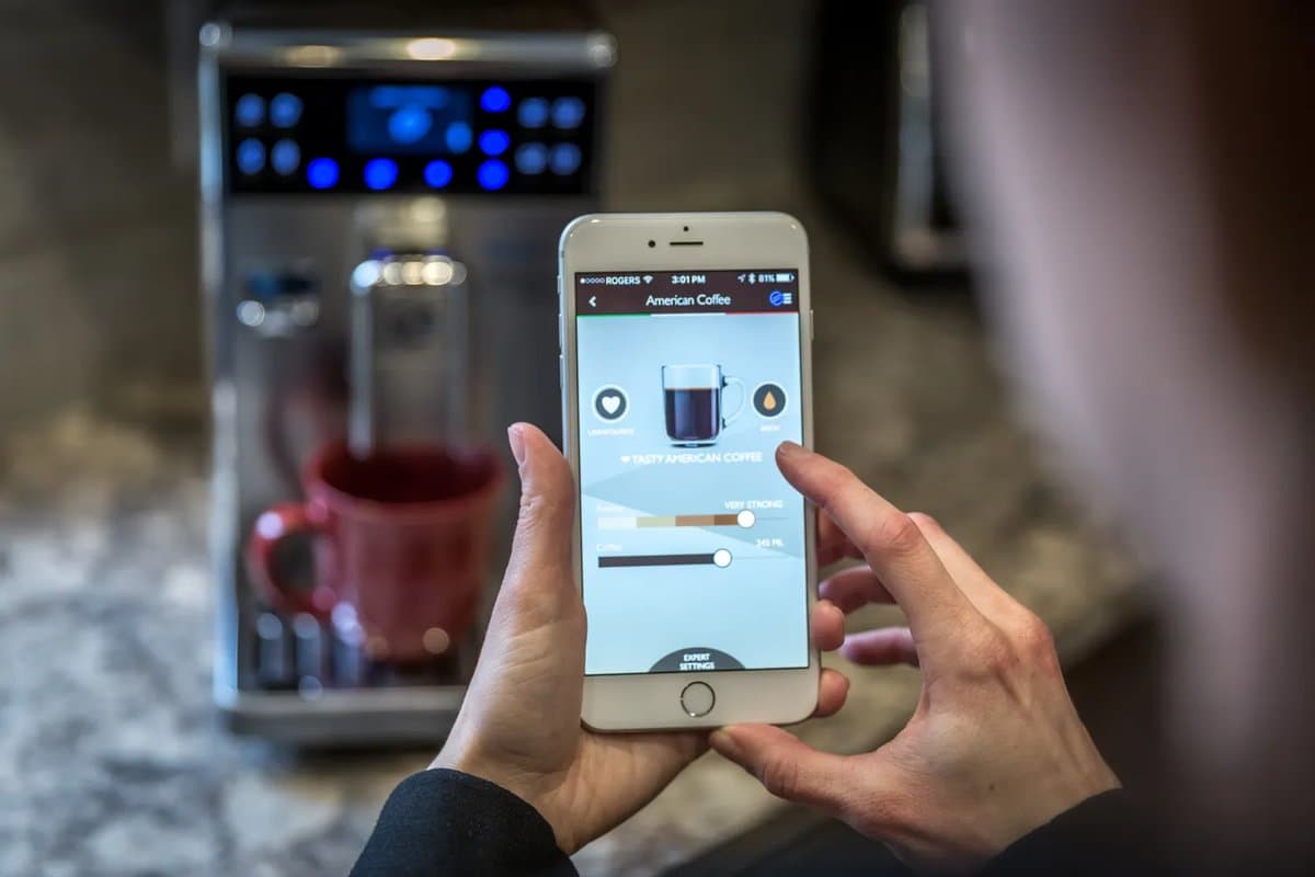 Smart coffee makers with smartphone app control arranged on a modern kitchen counter