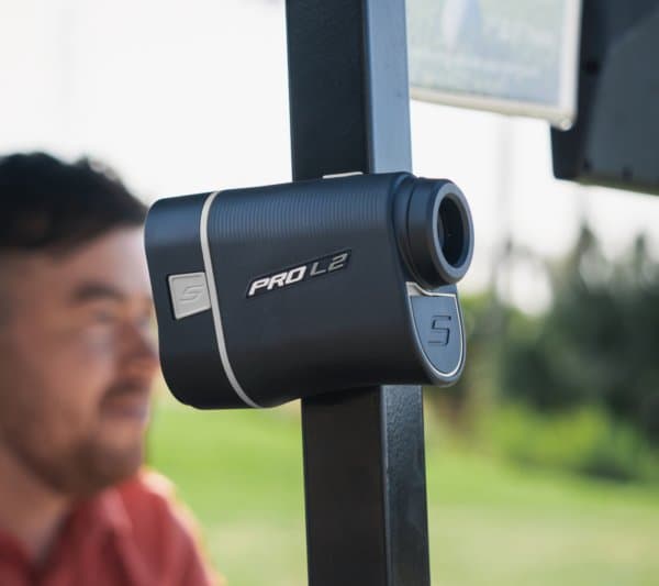 Shot Scope Pro L2 Rangefinder with magnetic mount attached to golf cart