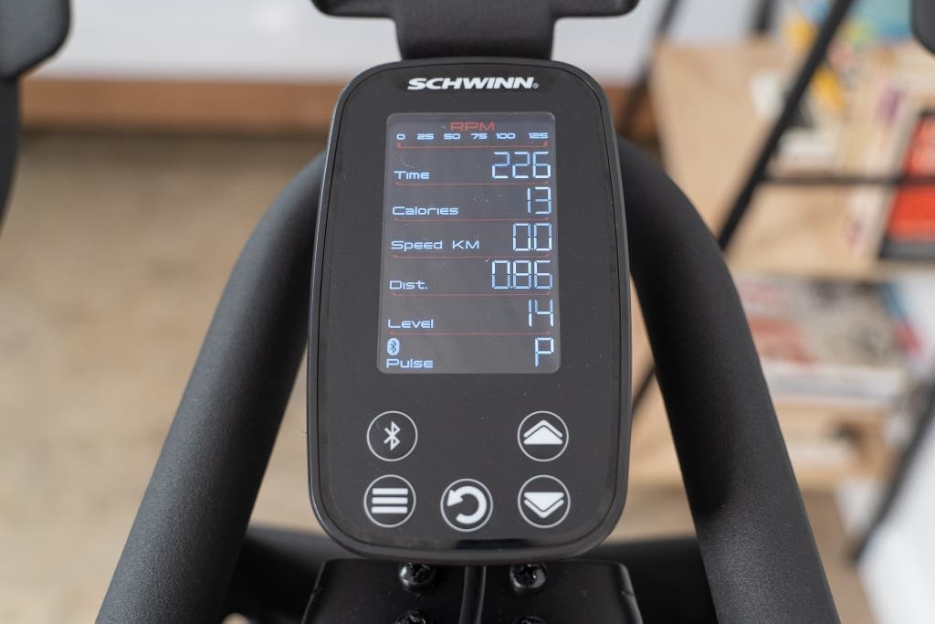 Merach exercise bike displaying health metrics on console