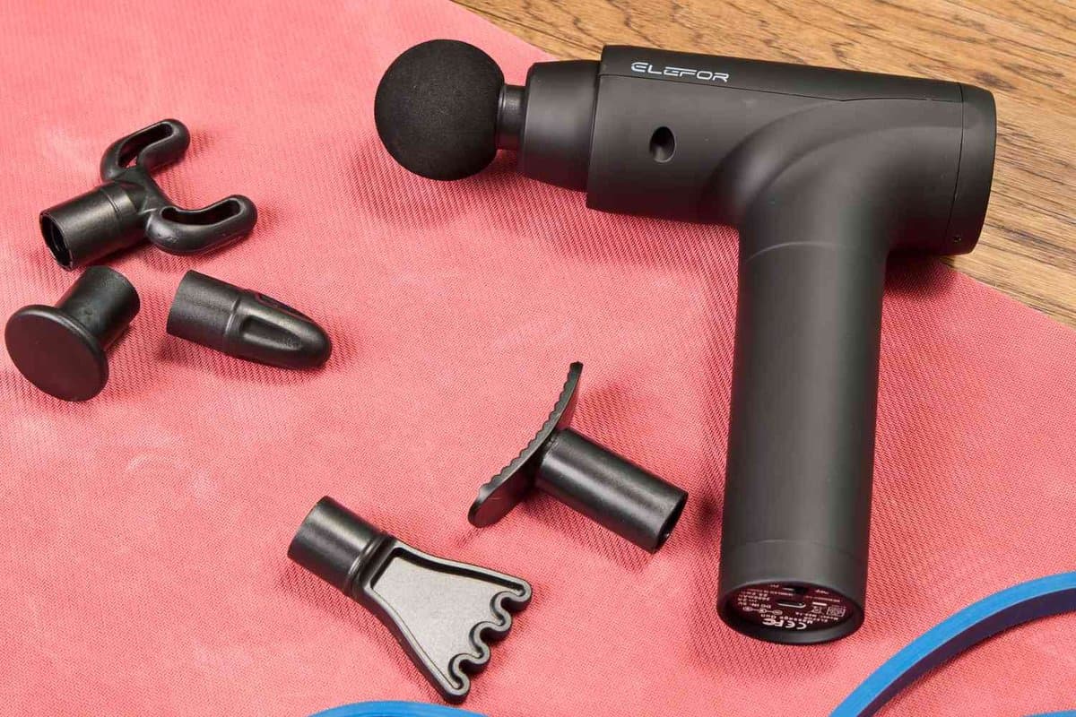 Budget massage gun with multiple attachment heads and carrying case