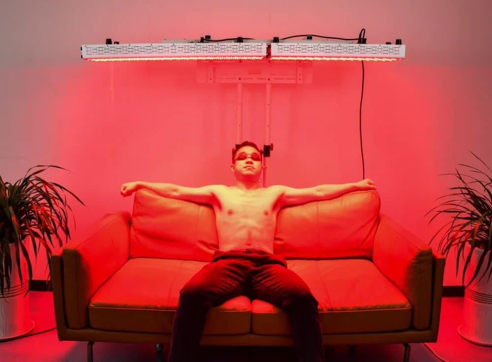 Professional red light therapy panel setup in modern home wellness room