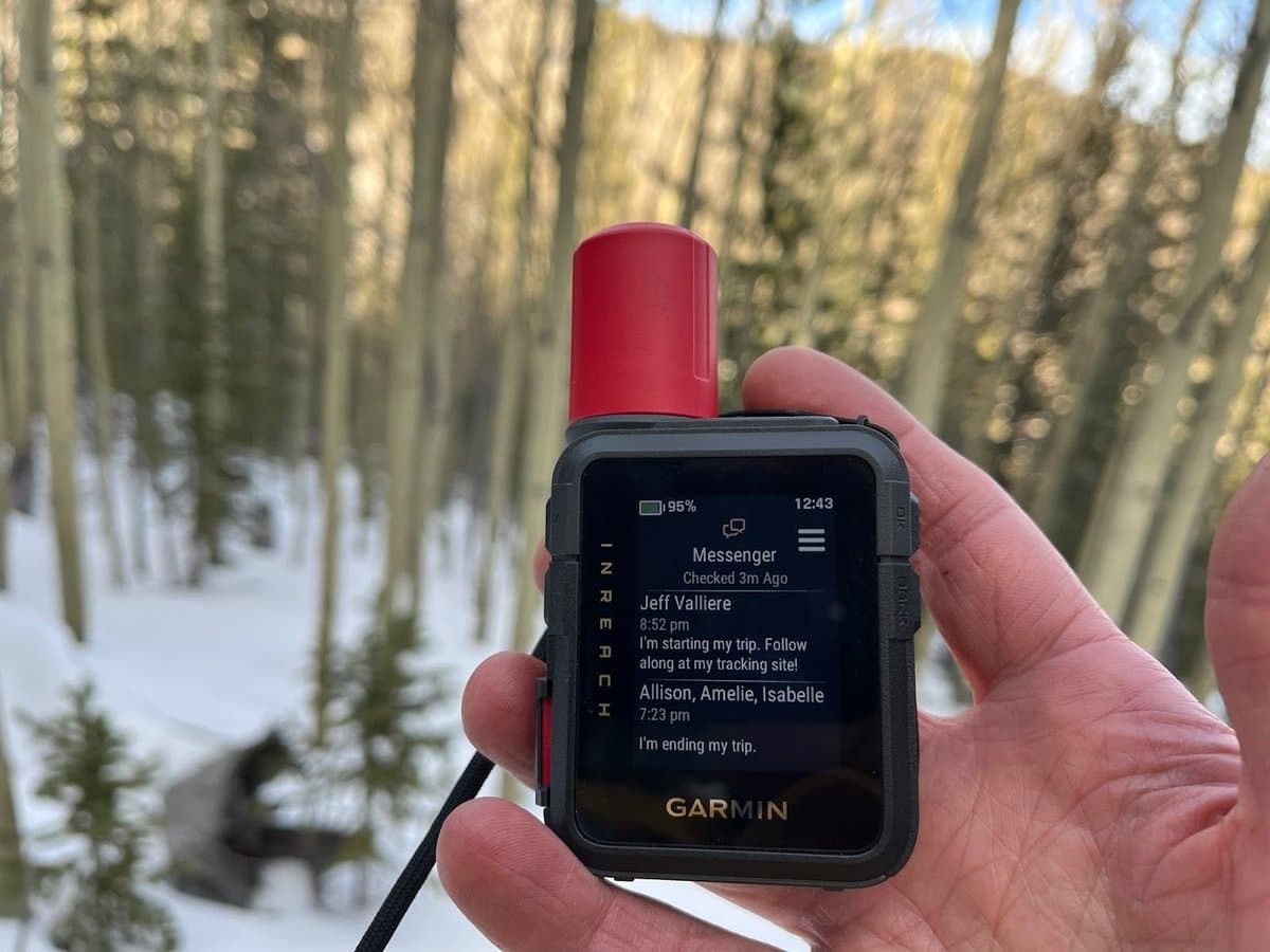 Garmin inReach Mini 3 base model showing basic LCD display in outdoor setting